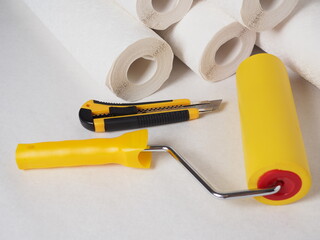 Wallpaper on the wall, a tool for wallpapering, repair in the house