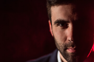 Close up shot of a man with beard.