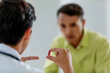 Asian patient consults doctor about healthy and his sickness