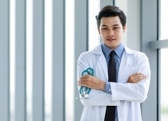 Fototapeta premium asian doctor standing and look smart