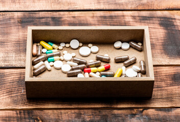 Choose the right pharmacy. Prescription drugs in pillbox. Assorted pharmaceutical drugs