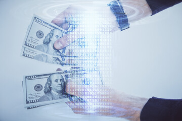 Multi exposure of technology drawing hologram and us dollars bills and man hands. Data concept