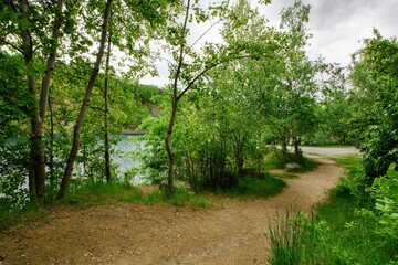 Footpath around the old flooded quarry. Bathing. The village of Vykleky. Central Moravia. Europe. _