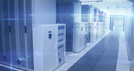 Computer servers in a server room with glowing lights