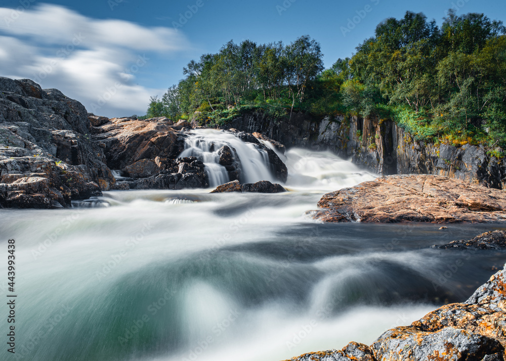 Wall mural beautiful waterfall on titovka river in kola peninsula tundra, after the spring rains