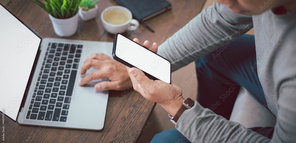 Aufkleber shot of man hand using, holding smartphone or mobile mockup with blank white screen display. phone t