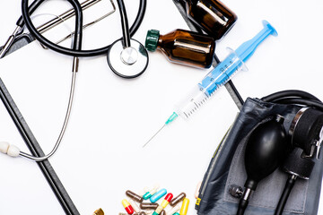 Pharmaceutical drugs syringe vials and tonometer with stethoscope isolated on white, healthcare.