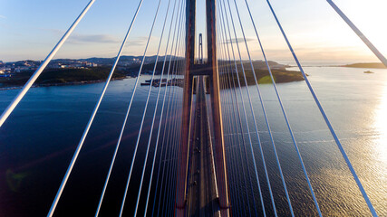 Russian bridge across the Eastern Bosphorus Strait in Vladivostok. View from above. The cables of...