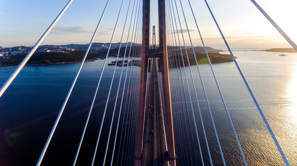 Obraz premium Russian bridge across the Eastern Bosphorus Strait in Vladivostok. View from above. The cables of the Russian bridge.