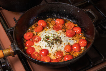Chef cooking food for italian cuisine, tomato sauce for pasta, mediterranean diet concpet, detailed view of hands and pan with fried tomatoes