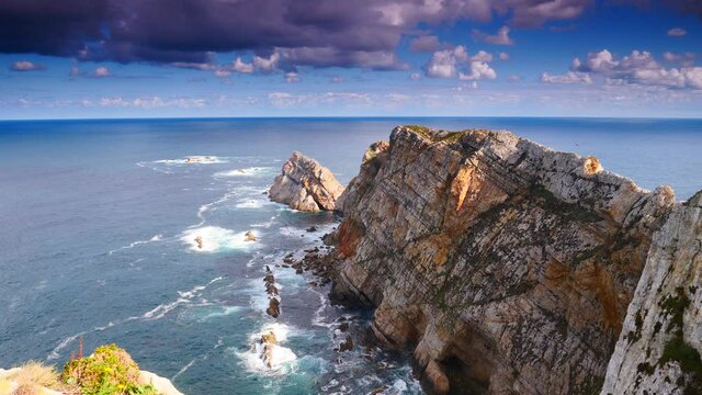 Seascape of Atlantic ocean and Asturias rocky coast at Cape Penas. Sea shore with high cliffs in north Spain.