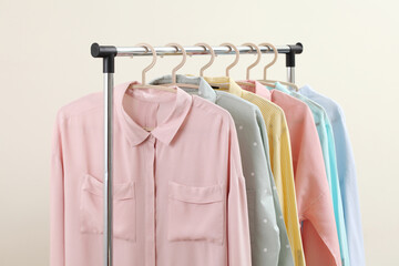 Pastel women shirts hanging on rack