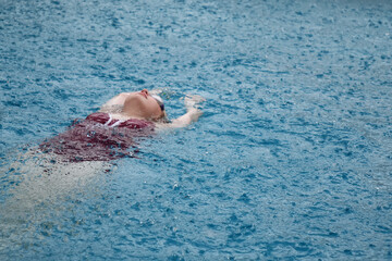 girl swims in the rain 