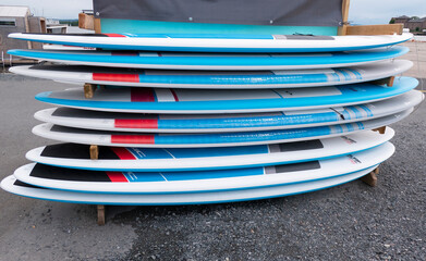 surfboards outside summer activity