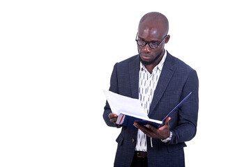 portrait of a young businessman checking a folder.