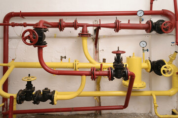 Red and yellow pipes, water supply management system in an industrial building