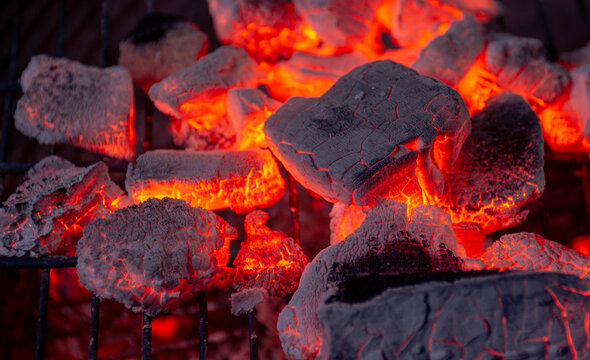 Burning coals from a fire abstract background