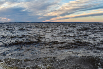 beautiful sunset and waves on the Volga River