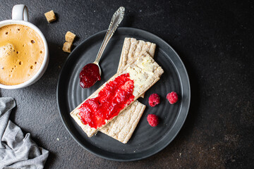 jam sandwich and cup of coffee berry jam, butter, organic whole grain diet bread crisp on the table, healthy food meal snack copy space food background rustic. top view