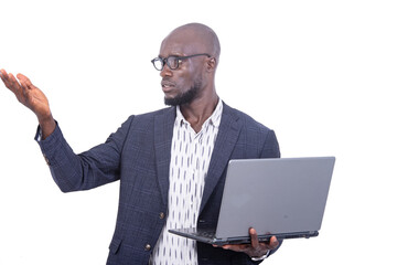 serious businessman holding laptop and pointing hand aside.