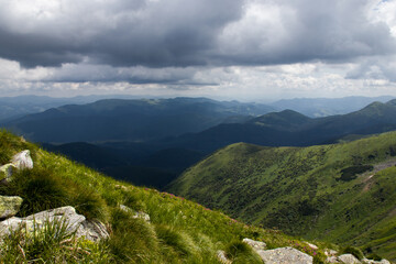 mountain peaks and clouds above them