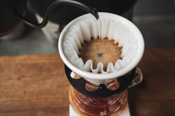 barista dripping coffee and slow coffee bar style