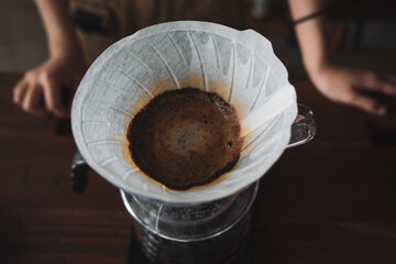 barista dripping coffee and slow coffee bar style