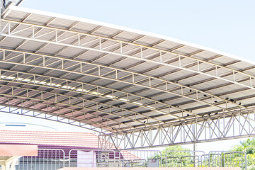 Fototapeta premium The roof of the large swimming pool is made with plate roof steel strong metal structure is of large dome with iron beams.