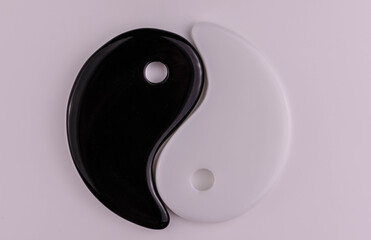 Japanese symbol of masculine and feminine beginning yin yang on a white background.