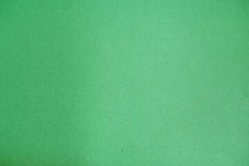 Green background. The texture of the cardboard.