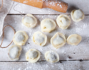 Chocolate dumplings on a white wooden background. Sweet dumplings.