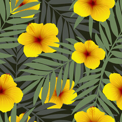 Yellow hibiscus flowers and tropical palm leaves. Seamless pattern with exotic plants for printing on fabric, textiles, paper, interior design.