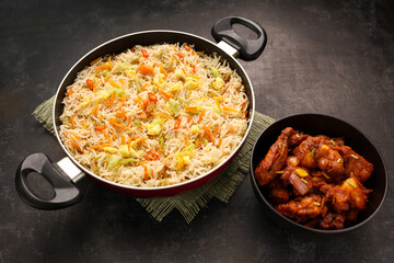 Chinese fried rice and chilly chicken curry Chicken fried rice with vegetables fried eggs basmati grain very popular food in restaurants Kerala Mumbai India Sri Lanka china