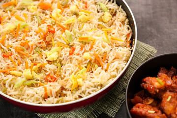 Chinese fried rice and chilly chicken curry Chicken fried rice with vegetables fried eggs basmati grain very popular food in restaurants Kerala Mumbai India Sri Lanka china