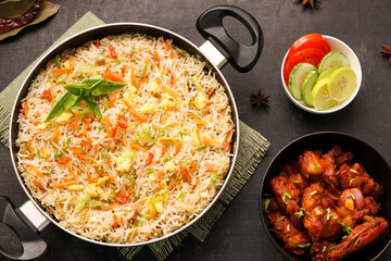 Chinese fried rice and chilly chicken curry Chicken fried rice with vegetables fried eggs basmati grain very popular food in restaurants Kerala Mumbai India Sri Lanka china