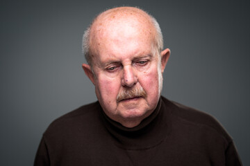 Senior man lonely at home, anxious/afraid to go out - self isolation/ quarantine due to COVID-19/ Coronavirus social distancing/prevention concept