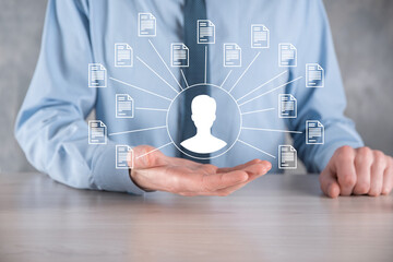 Document Management System DMS .Businessman hold user and document icon.Software for archiving,...