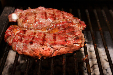 Tasty ancho steak grilled on the barbecue. Barbecue of Contra Filet. Barbecue gastronomic photography.