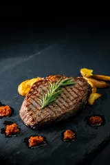 Fotobehang beef steak on a dark background © Richard Semik