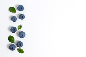 Ripe freshly picked local produce blueberries. Close up, copy space for text, top view, background. Healthy vegan snacks full of antioxidants. Seasonal summer berries. Clean eating concept.