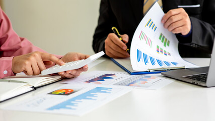 Close up of marketing manager employee pointing at business document,Brainstorming stock market investment plans,With statistical data showing profits and income teamwork concept.