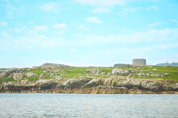 Blue sky and sunny day with Fort, Martello tower, Saint Begnet's Church on Dalkey Island, County...