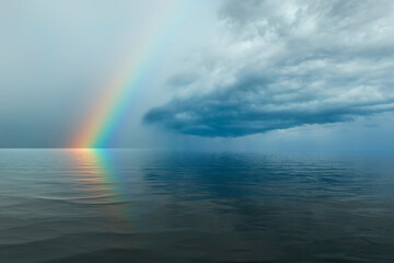 beautiful summer landscape after rain with sea and rainbow