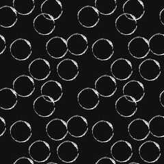 Traces from a glass on a black background. Vector and seamless rings. Drawn circles in chaotic positions.
