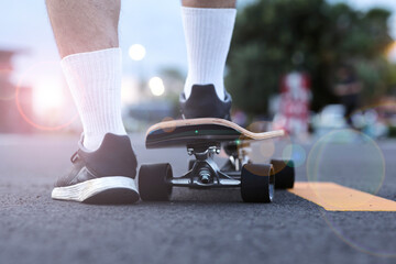 person prepare to start riding on a surf skateborad.
