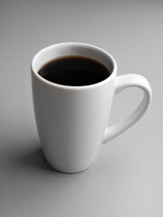 Delicious and hot black filter coffee in a white tall cup