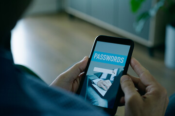 using a password manager app in his smartphone