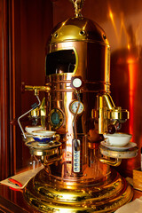 Obraz na płótnie Canvas Gilded vintage coffee and tea machine.