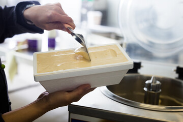Vanilla ice cream in thermal insulation packaging at factory