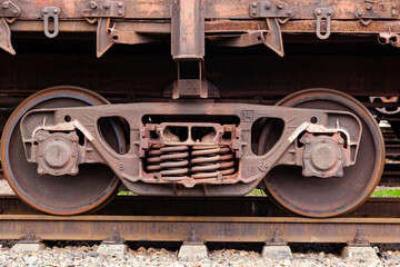Railroad car chassis with wheels on rails.
